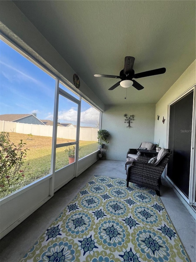 sunroom / solarium with ceiling fan