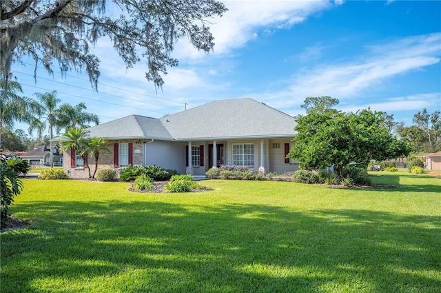 ranch-style home featuring a front lawn