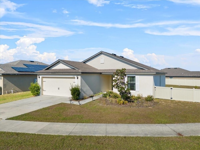 ranch-style home with a garage and a front lawn