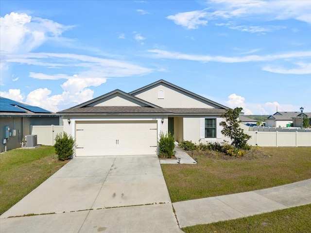 ranch-style home featuring a garage, central AC unit, and a front yard