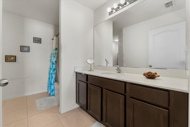 bathroom with tile patterned flooring, shower / bath combination with curtain, and vanity