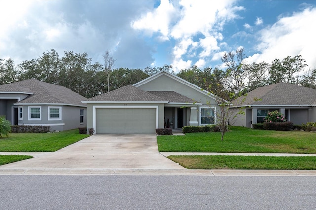 ranch-style house featuring a garage and a front lawn