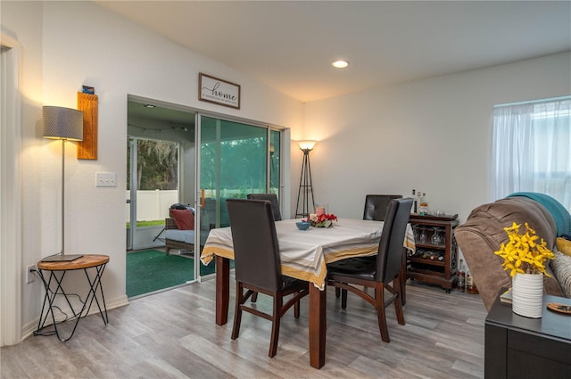 dining area with hardwood / wood-style floors