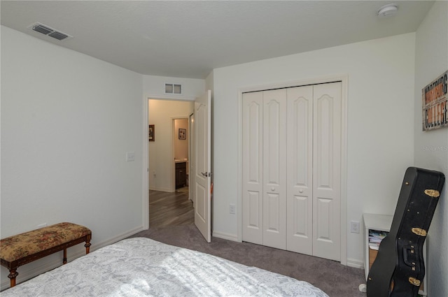 carpeted bedroom with a closet