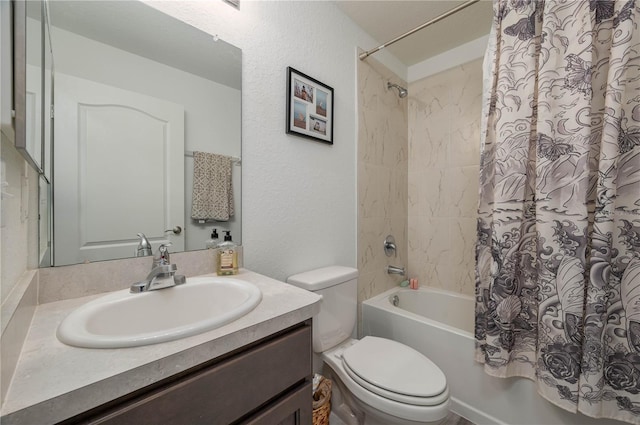 full bathroom featuring vanity, shower / bath combo, and toilet