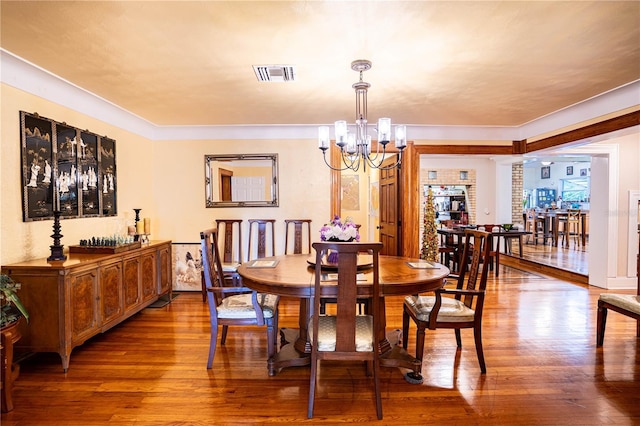 dining room featuring hardwood / wood-style floors and a notable chandelier