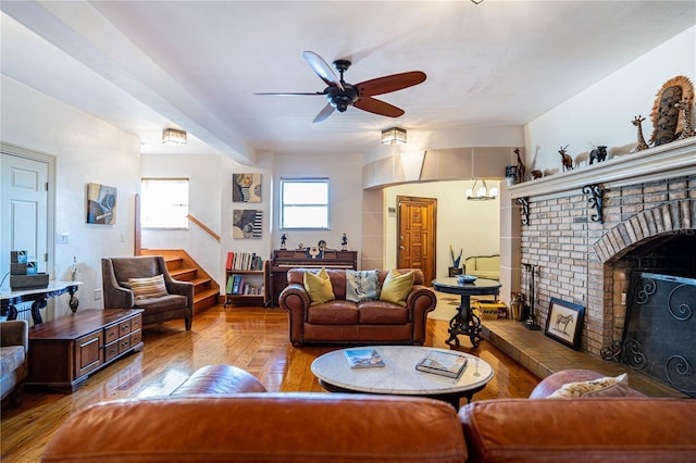 living room with ceiling fan, a fireplace, and hardwood / wood-style flooring