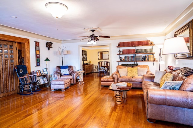 living room with ceiling fan and hardwood / wood-style flooring