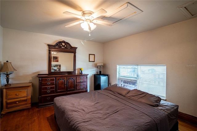 bedroom with ceiling fan and dark hardwood / wood-style floors