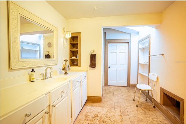 bathroom featuring tile patterned flooring and vanity