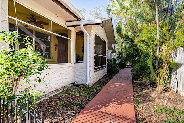 view of side of property featuring ceiling fan