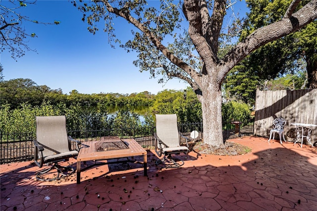 view of patio featuring a water view