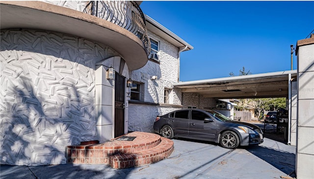 view of property exterior featuring a carport