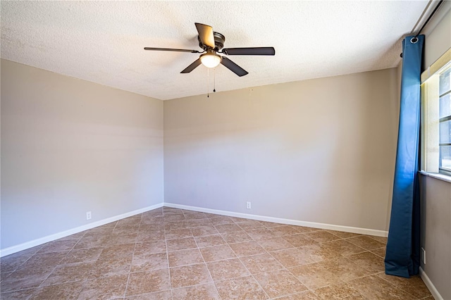 spare room featuring ceiling fan and a textured ceiling