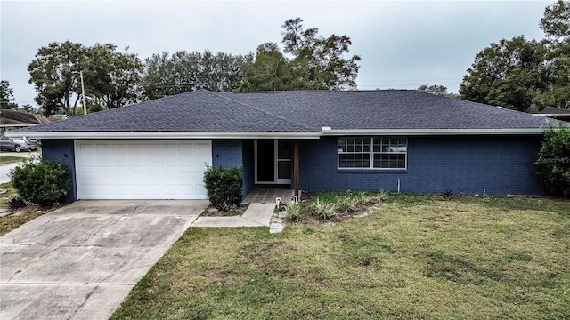 single story home featuring a front yard and a garage