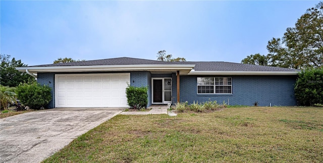 single story home featuring a garage and a front lawn