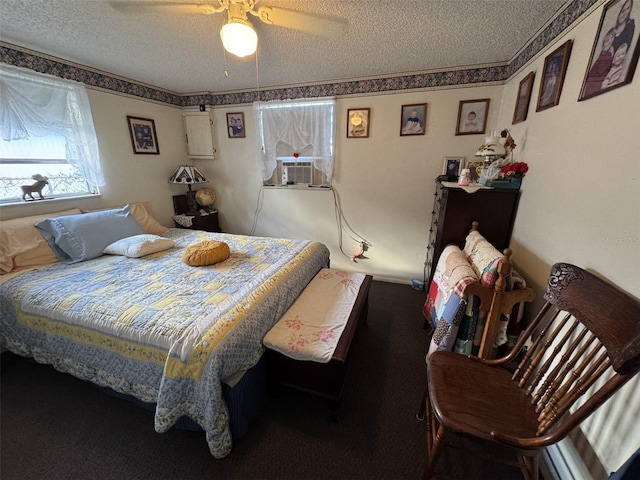 bedroom with ceiling fan, cooling unit, and a textured ceiling