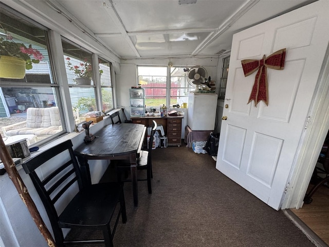 dining space with dark carpet