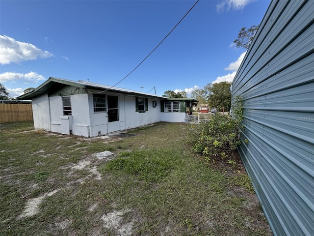 exterior space with a yard