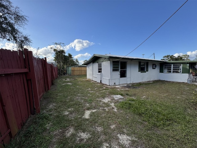 view of home's exterior with a lawn