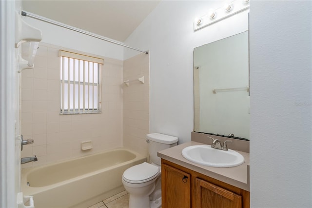 full bathroom featuring vanity, tile patterned floors, tiled shower / bath combo, and toilet