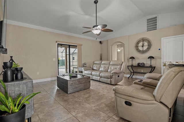 living room featuring ceiling fan, light tile patterned floors, and lofted ceiling