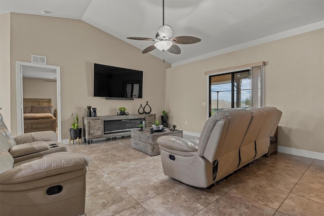 tiled living room featuring ceiling fan and lofted ceiling