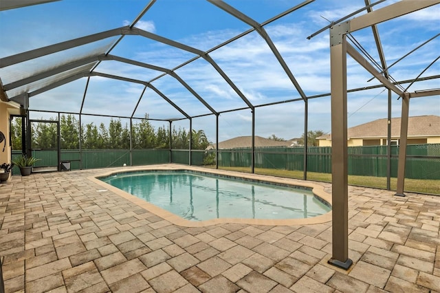 view of pool featuring a lanai and a patio