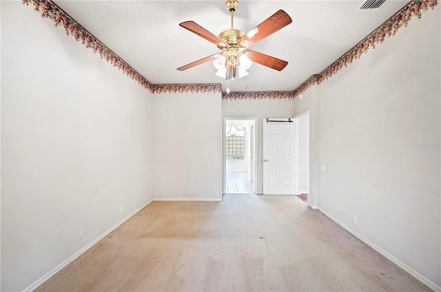 carpeted empty room with ceiling fan