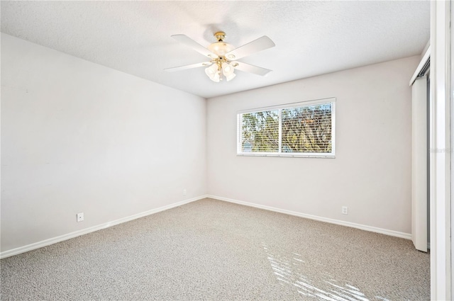 unfurnished bedroom with carpet flooring, a textured ceiling, and ceiling fan