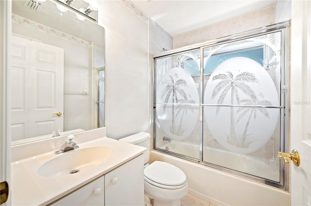 full bathroom featuring vanity, bath / shower combo with glass door, and toilet