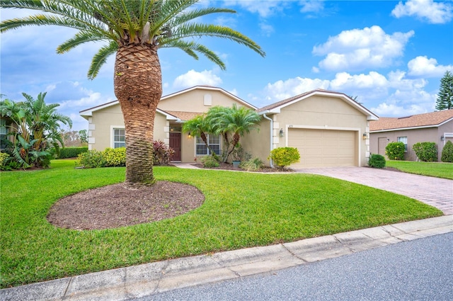 view of front facade with a front yard and a garage