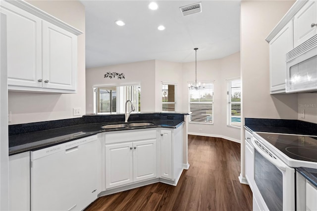 kitchen with white cabinetry, white appliances, sink, and dark wood-type flooring