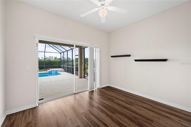 spare room featuring ceiling fan and hardwood / wood-style flooring