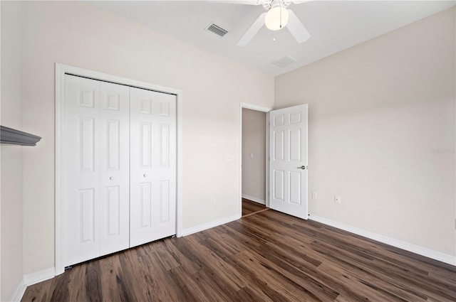 unfurnished bedroom featuring ceiling fan, a closet, and dark hardwood / wood-style floors