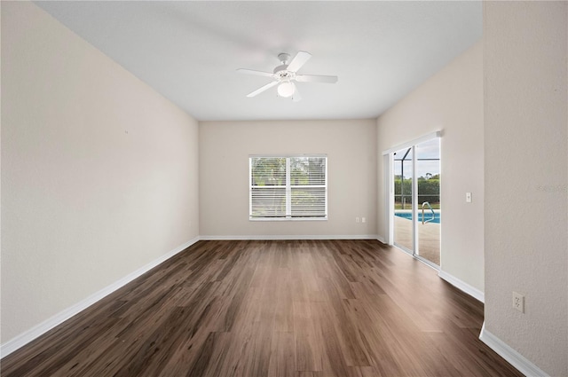 unfurnished room featuring ceiling fan and dark hardwood / wood-style flooring