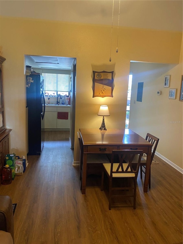 dining room featuring dark hardwood / wood-style floors and sink