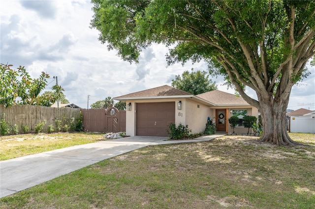 single story home with a front lawn and a garage