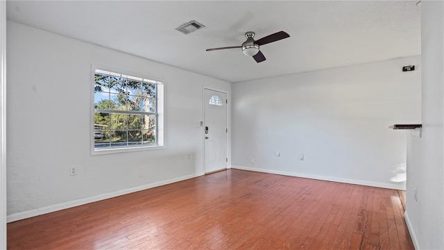 empty room with wood-type flooring and ceiling fan