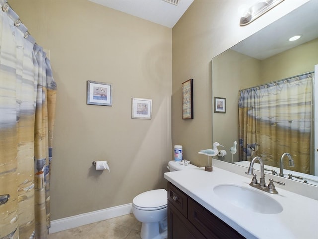 bathroom featuring tile patterned flooring, vanity, and toilet