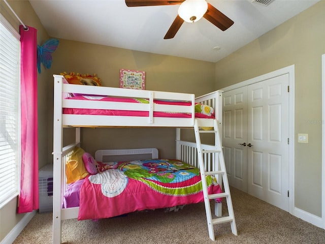 bedroom featuring carpet flooring, ceiling fan, and a closet