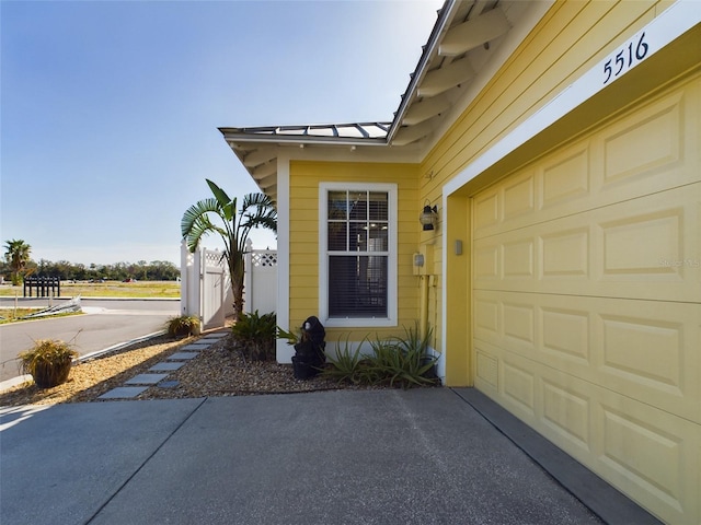 view of exterior entry with a garage