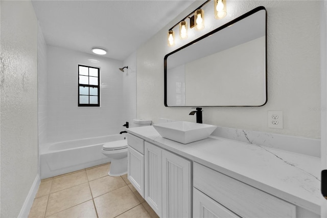 full bathroom with tile patterned floors, vanity, tiled shower / bath combo, and toilet