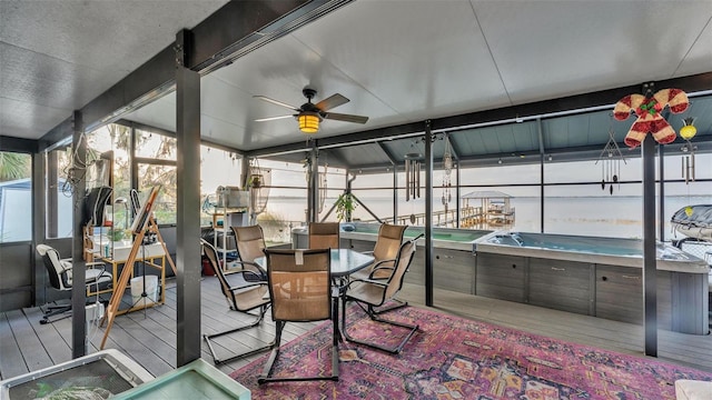 1769 S Lake Reedy Blvd, Frostproof, FL 33843 - sunroom featuring a jacuzzi, a ceiling fan, and outdoor dining area