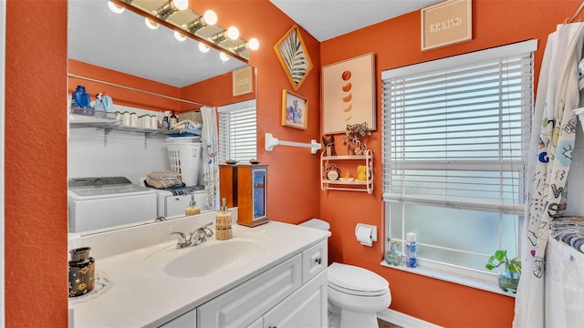 1769 S Lake Reedy Blvd, Frostproof, FL 33843 - bathroom featuring vanity, independent washer and dryer, and a shower with shower curtain