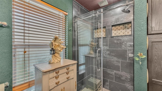 1769 S Lake Reedy Blvd, Frostproof, FL 33843 - full bathroom featuring a stall shower and a textured wall