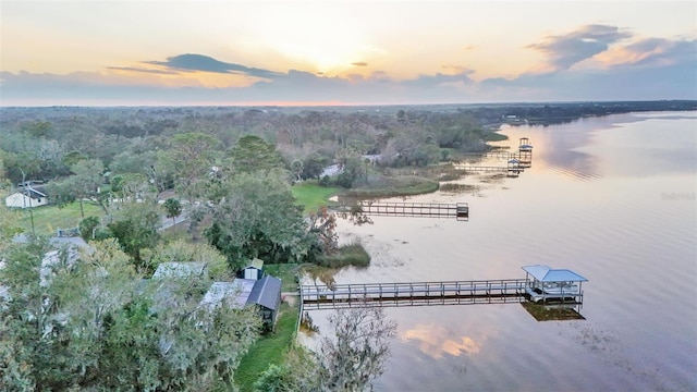 aerial view at dusk with a water view