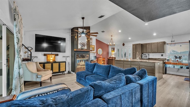1769 S Lake Reedy Blvd, Frostproof, FL 33843 - living area featuring light wood-style floors, a ceiling fan, lofted ceiling, and recessed lighting