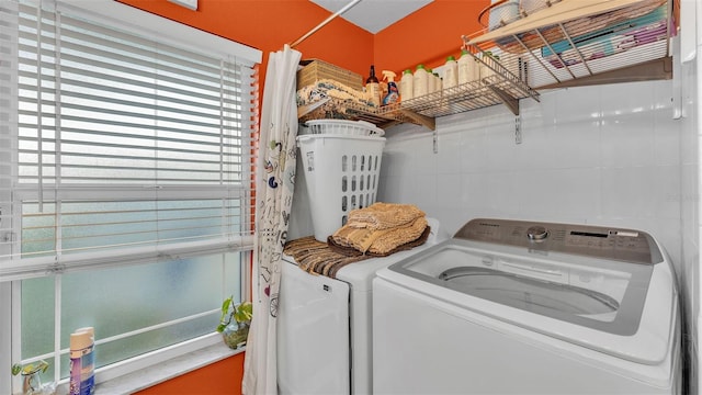 laundry area featuring independent washer and dryer and a wealth of natural light