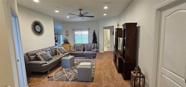 carpeted living area featuring a ceiling fan, recessed lighting, and visible vents